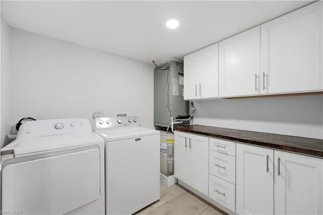 a view of storage and utility room with washer and dryer