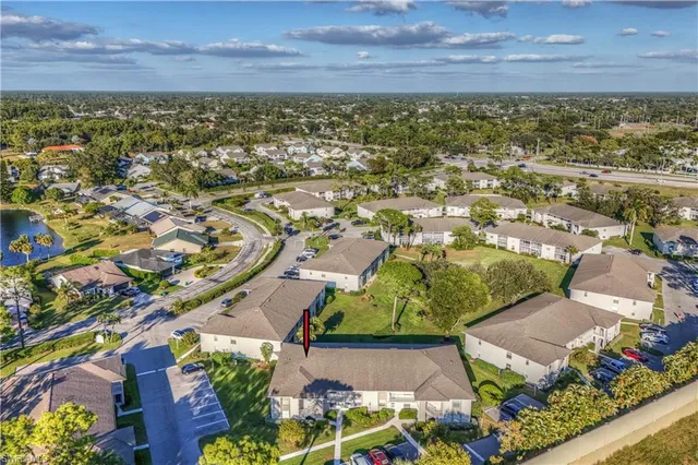 an aerial view of residential houses and outdoor space