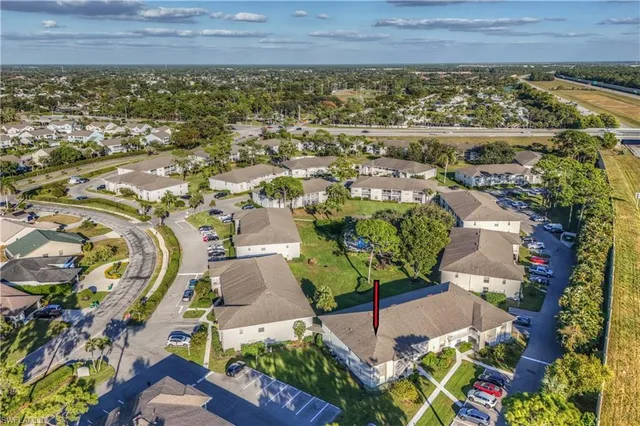 a view of a wooden door with a yard