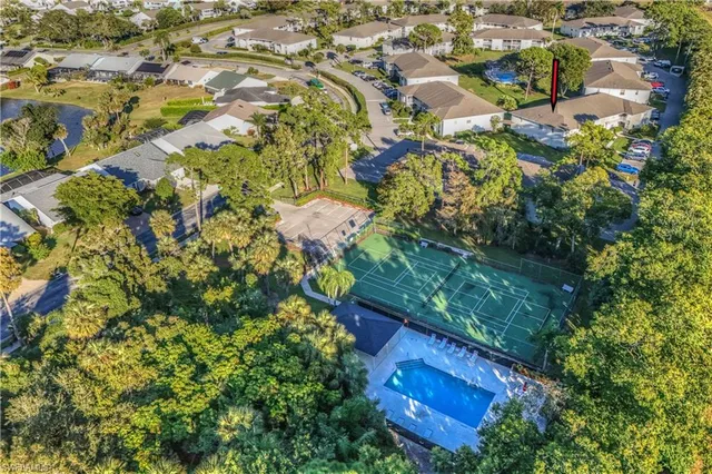 an aerial view of a house with a swimming pool yard and outdoor seating