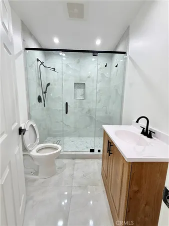 an empty room with window and ceiling fan