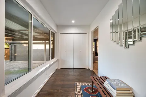 a open kitchen with sink cabinets and wooden floor