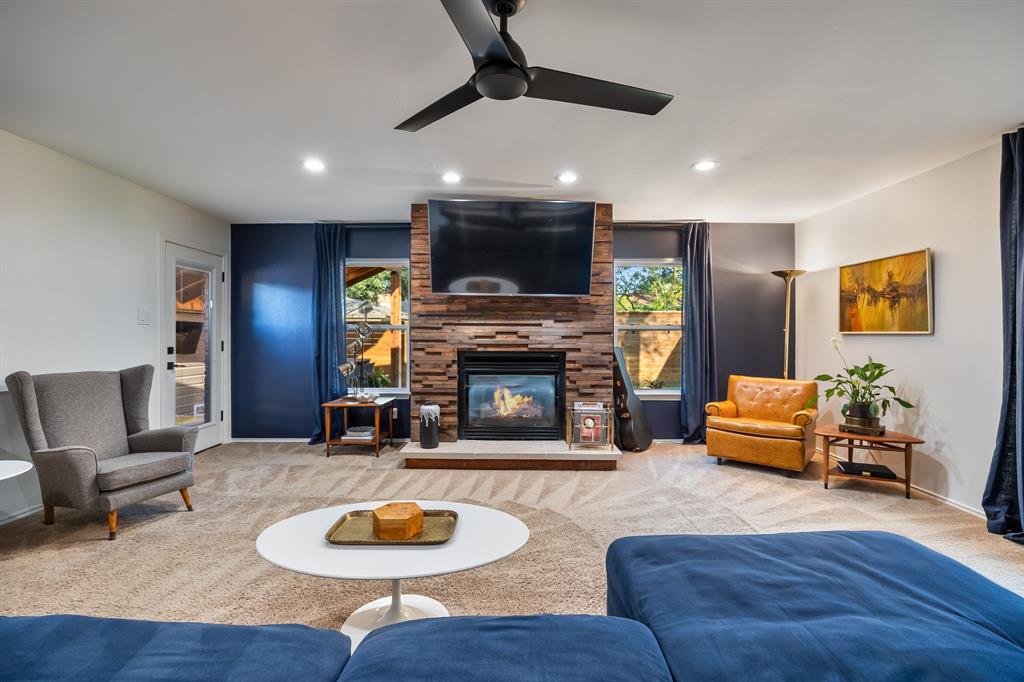 11718 Rogue Way Dallas, TX 75218 - Photo 16 of 35 a living room with furniture and a fireplace