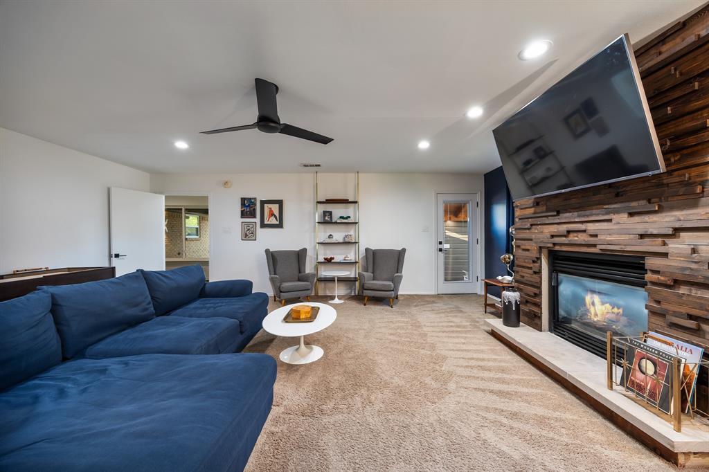 11718 Rogue Way Dallas, TX 75218 - Photo 17 of 35 a living room with furniture and a fireplace