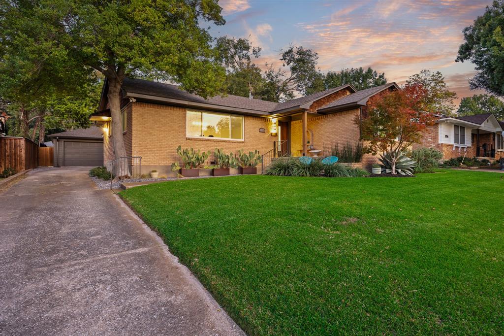 11718 Rogue Way Dallas, TX 75218 - Photo 2 of 35 front view of a house with a yard