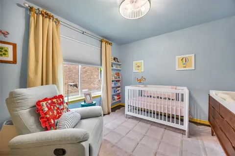 a bathroom with a granite countertop sink toilet mirror vanity and shower