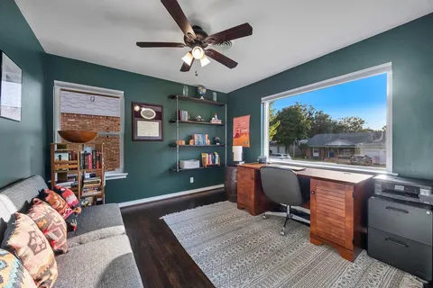 a bedroom with furniture and a window