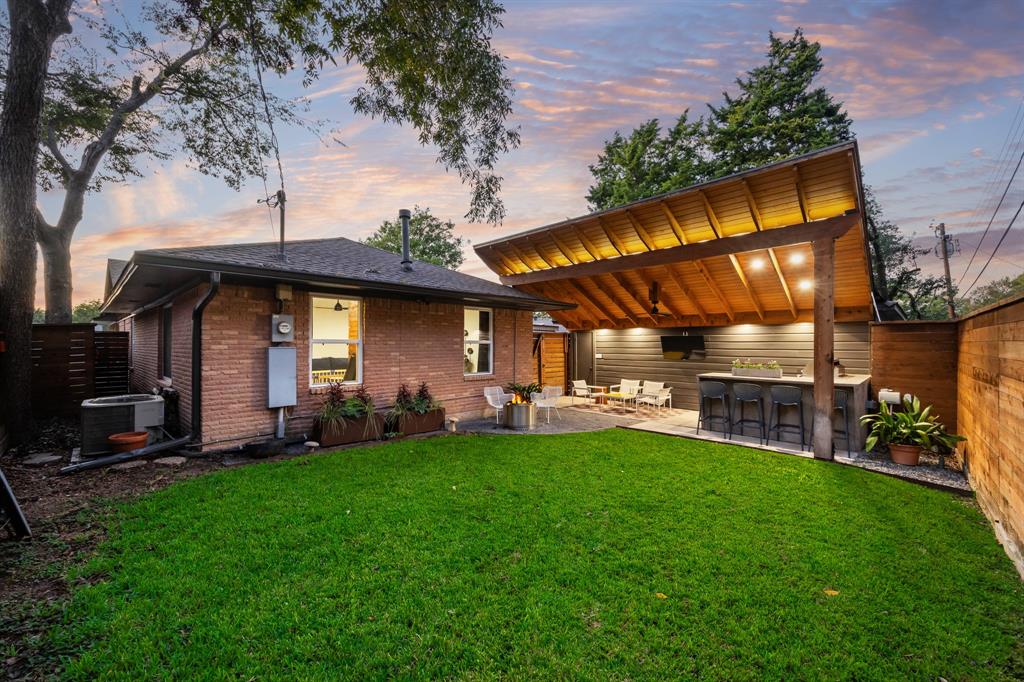 11718 Rogue Way Dallas, TX 75218 - Photo 25 of 35 a view of a house with a yard porch and sitting area