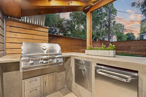 a view of a backyard with sitting area