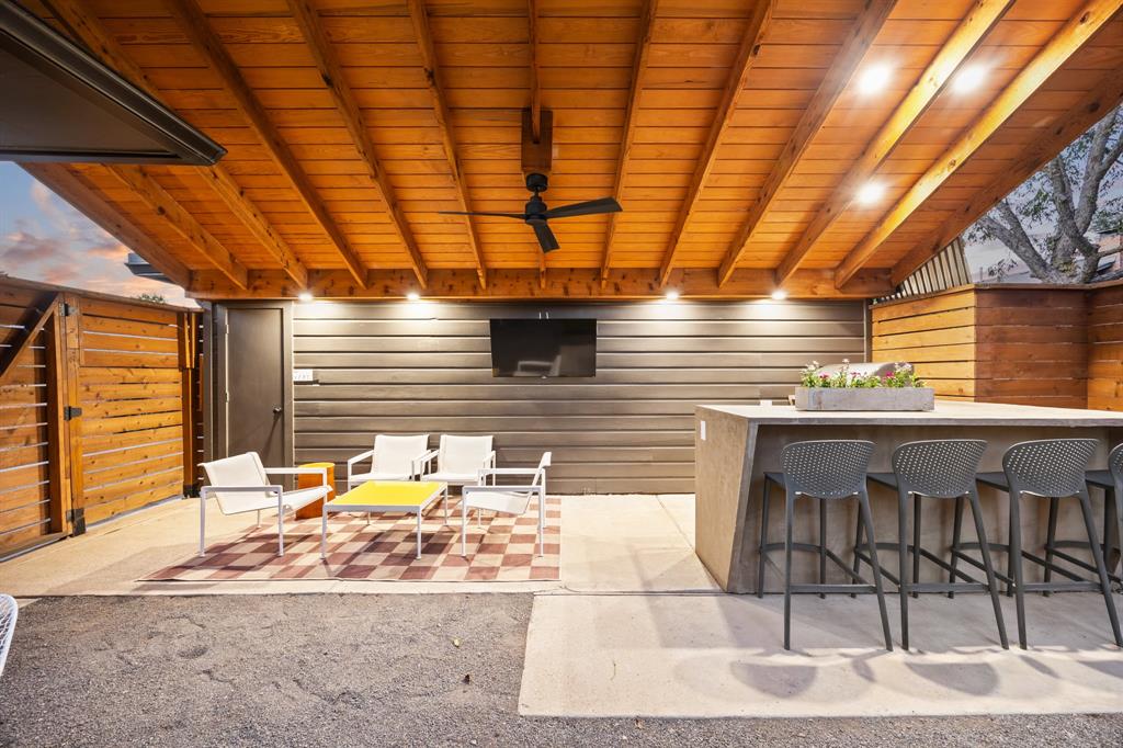 11718 Rogue Way Dallas, TX 75218 - Photo 28 of 35 a patio with a table and chairs