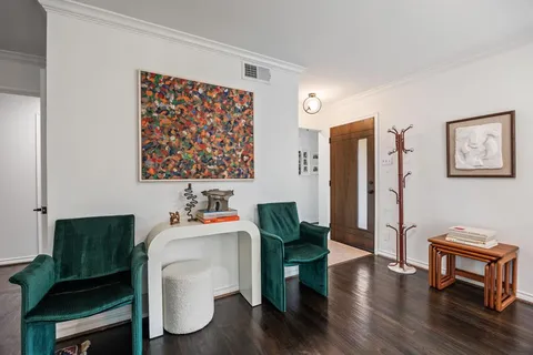 a dining room with furniture a rug and a window