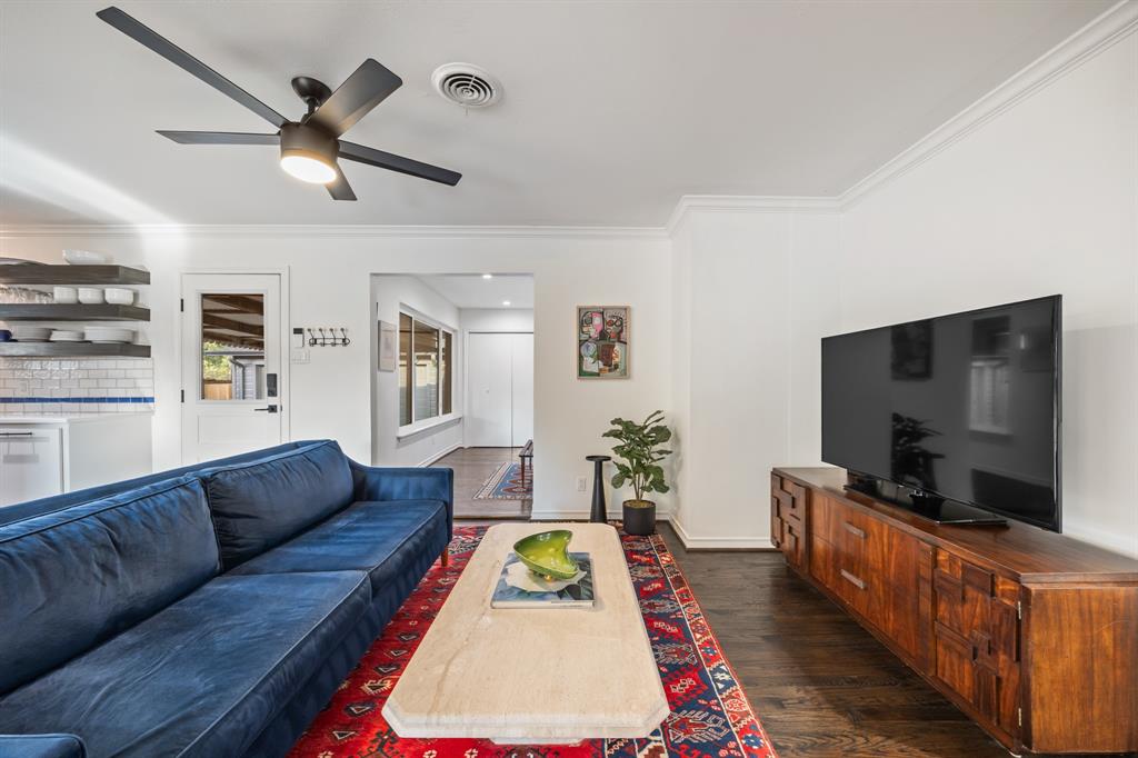 11718 Rogue Way Dallas, TX 75218 - Photo 6 of 35 a living room with furniture and a flat screen tv