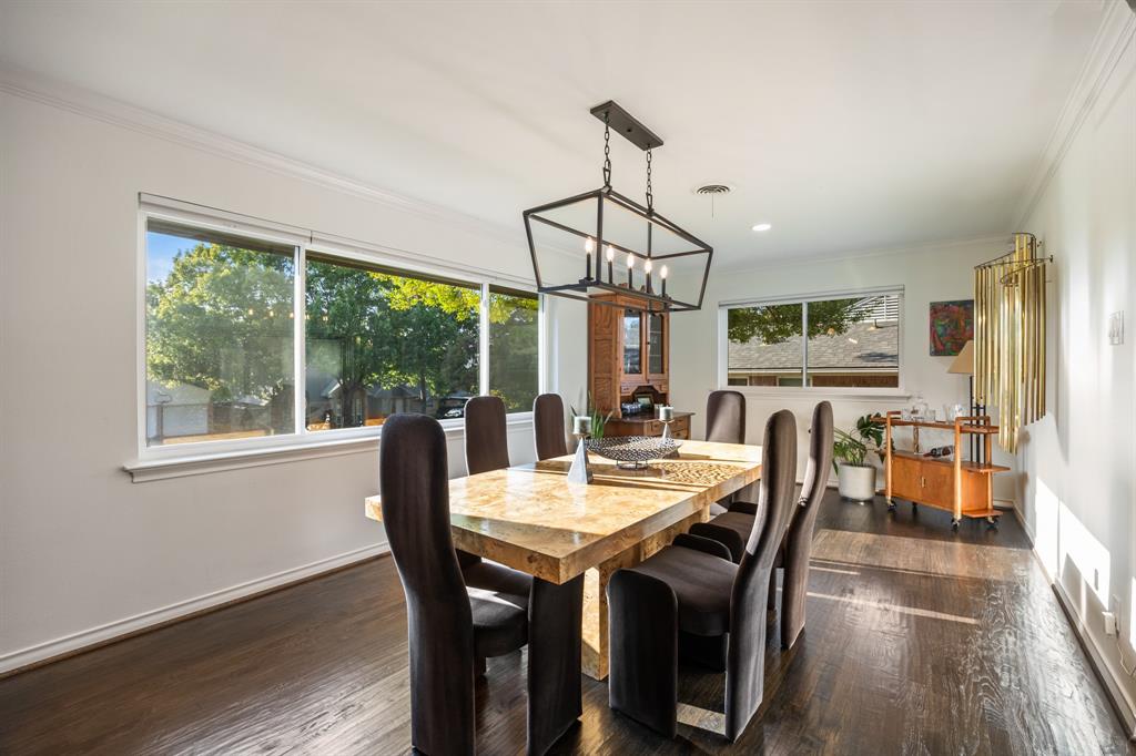 11718 Rogue Way Dallas, TX 75218 - Photo 7 of 35 a view of a dining room with furniture window and wooden floor