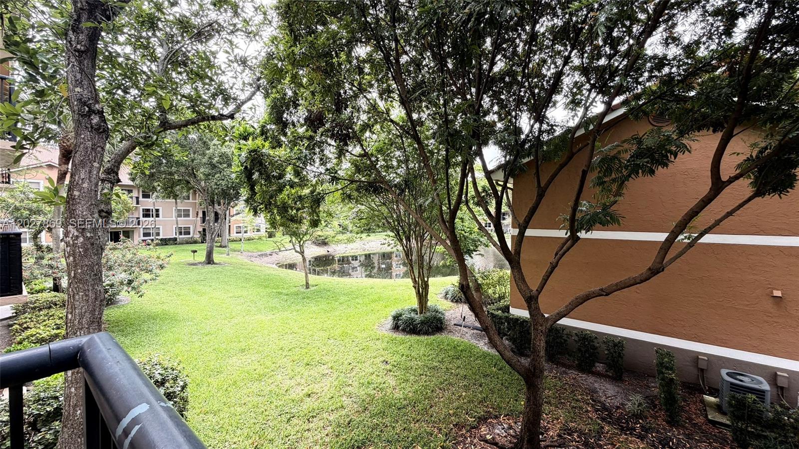 8761 Wiles Road, Unit 206 Coral Springs, FL 33067 - Photo 5 of 26 a view of an outdoor space and yard