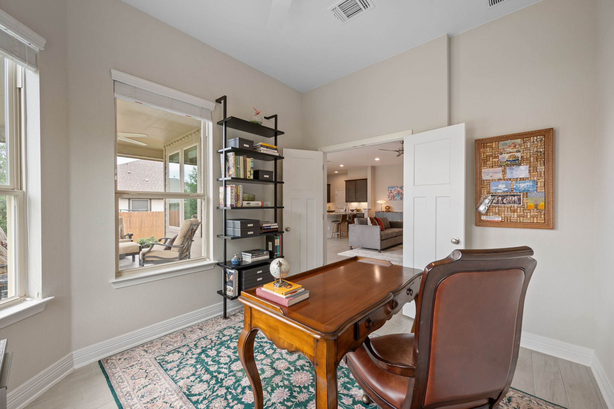 408 Bell Boot Pass Georgetown, TX 78626 - Photo 20 of 40 This room features light-colored walls, ample natural light from windows, and a doorway leading to additional living areas