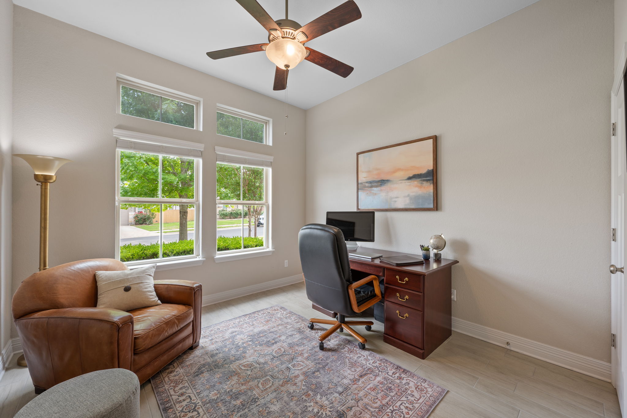 408 Bell Boot Pass Georgetown, TX 78626 - Photo 22 of 40 This versatile room features light-colored walls, large windows, and a ceiling fan, creating an inviting atmosphere