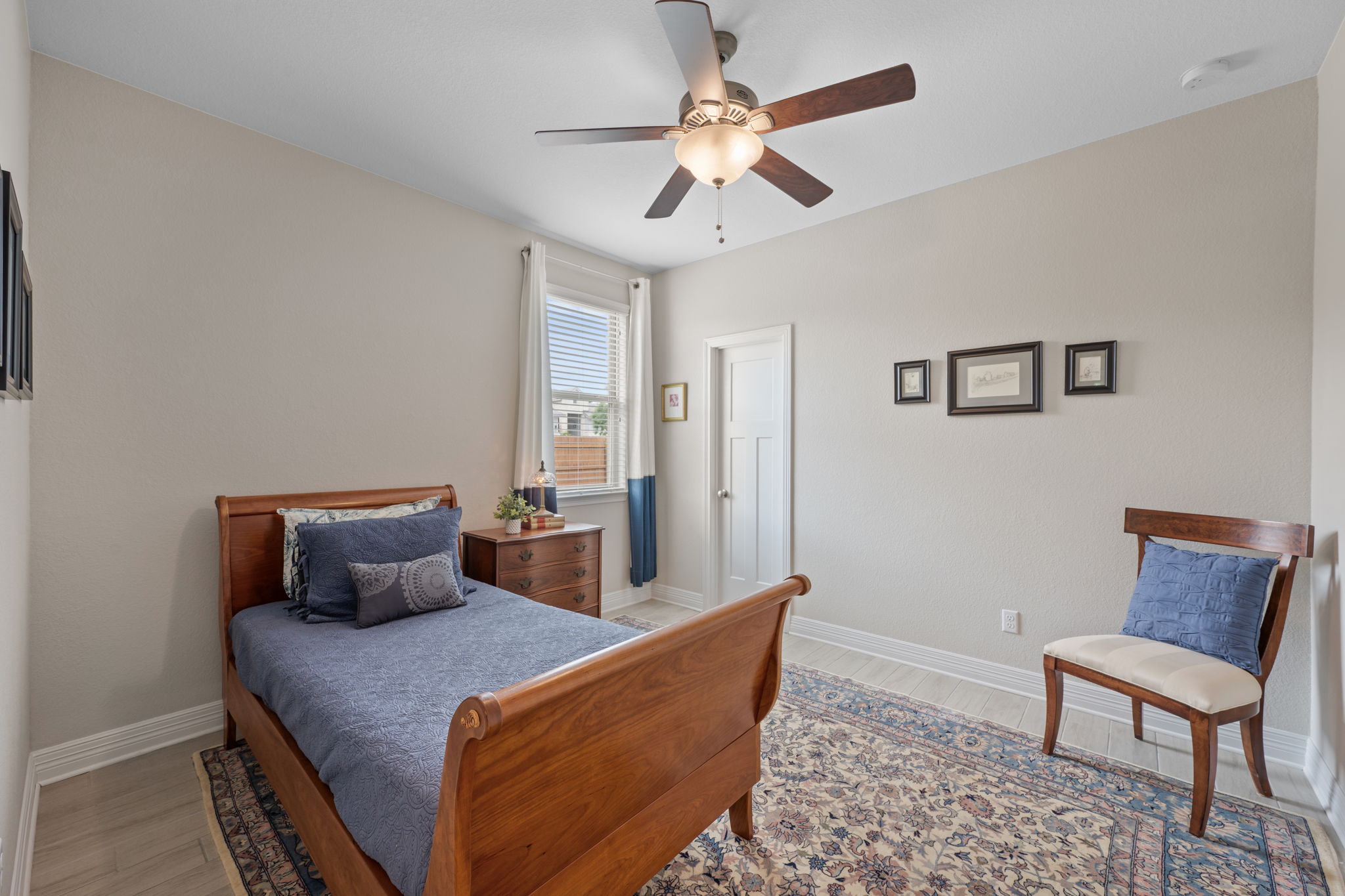 408 Bell Boot Pass Georgetown, TX 78626 - Photo 23 of 40 The bedroom features a ceiling fan, a window with blinds, and light-colored walls