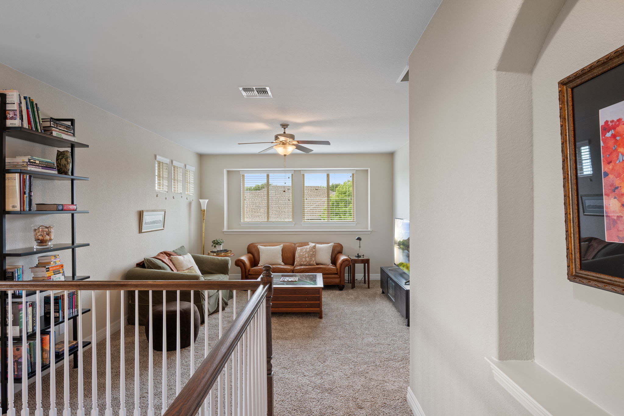 408 Bell Boot Pass Georgetown, TX 78626 - Photo 26 of 40 This inviting living space features carpeted floors, a ceiling fan, and large windows that provide abundant natural light