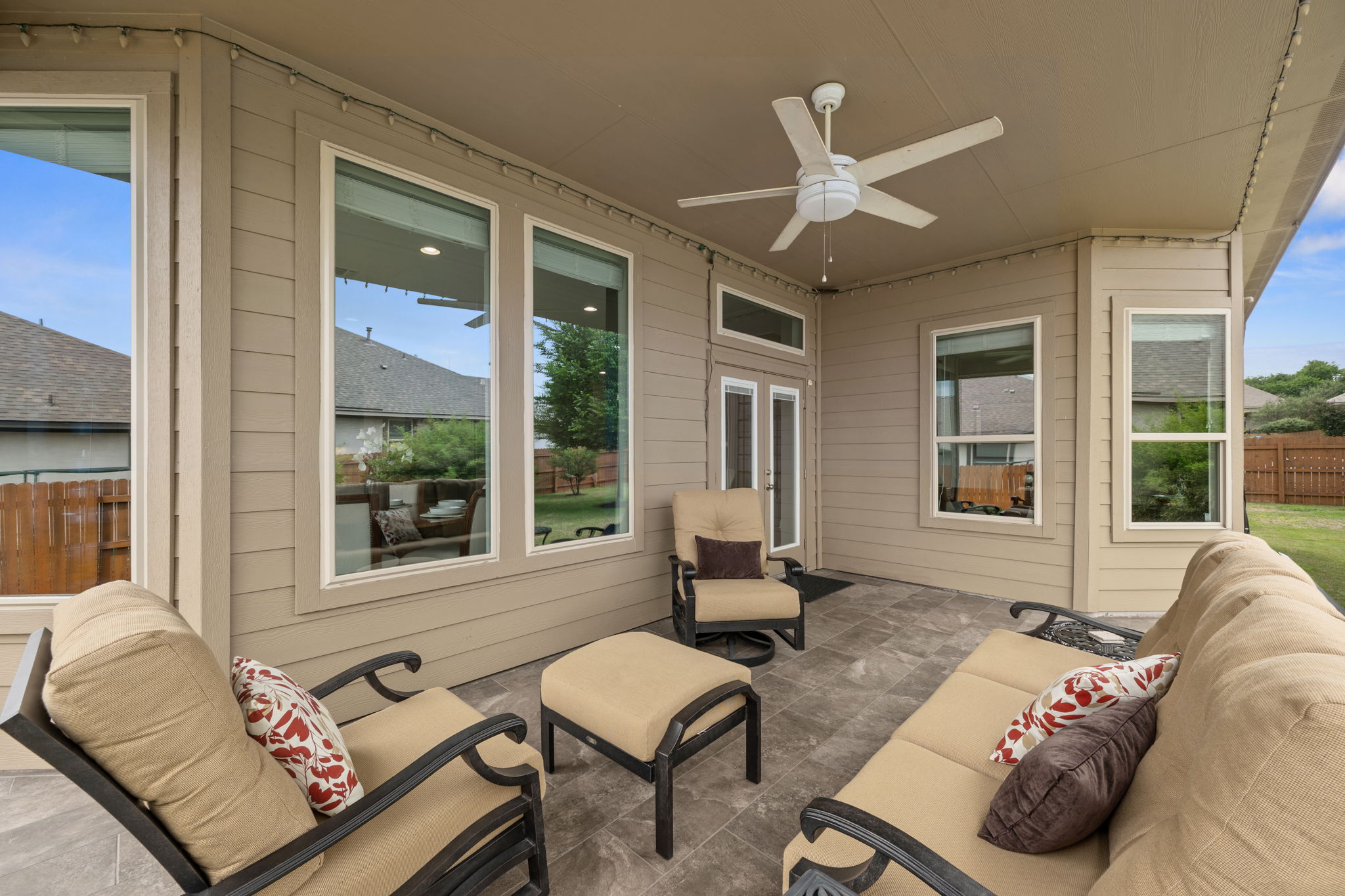 408 Bell Boot Pass Georgetown, TX 78626 - Photo 30 of 40 Covered outdoor patio area featuring a ceiling fan, tiled flooring, and views of the fenced yard