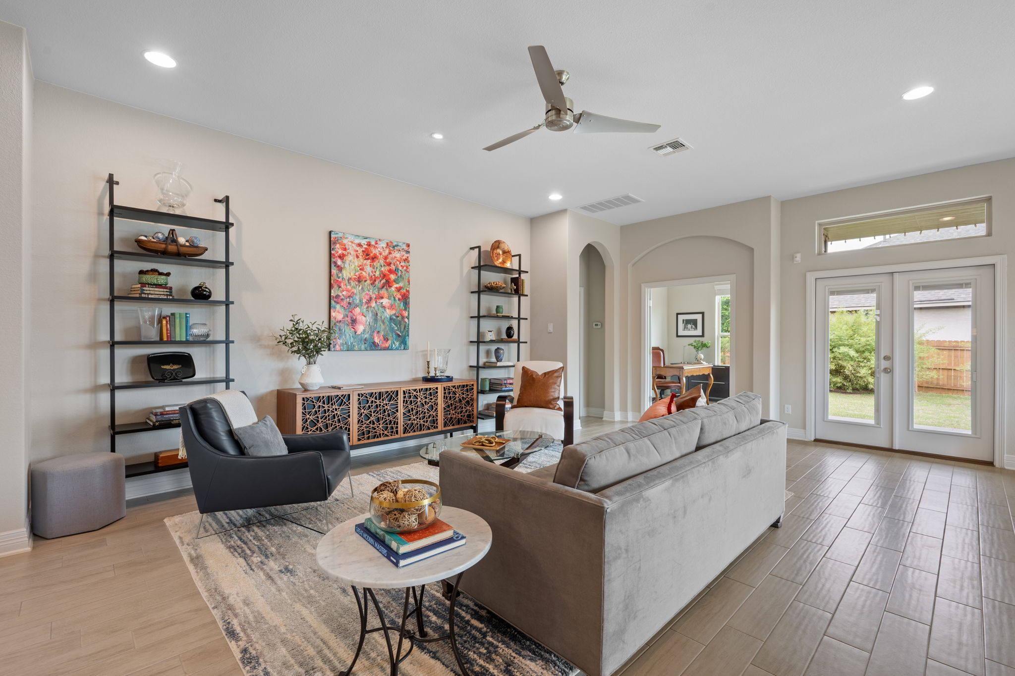 408 Bell Boot Pass Georgetown, TX 78626 - Photo 5 of 40 Spacious living area featuring light-colored walls, recessed lighting, and a ceiling fan