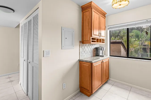 a kitchen with a stove a fridge and a window