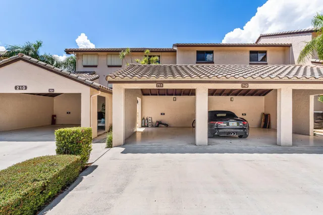 a view of a car park in front of house