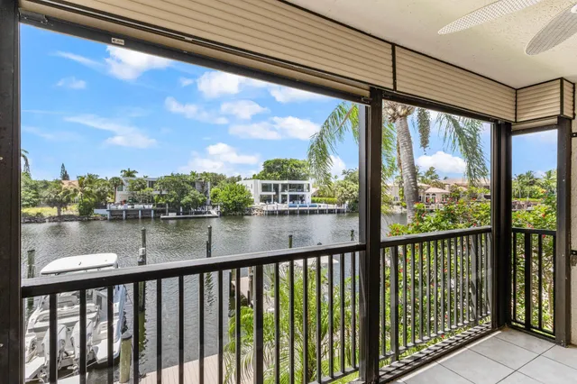 a view of a chairs and table in patio yard
