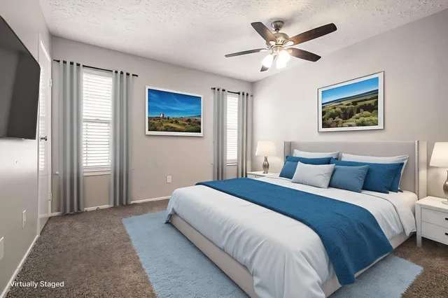 a bedroom with bed and window