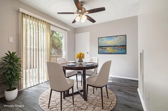 a view of a dining room with furniture window and wooden floor