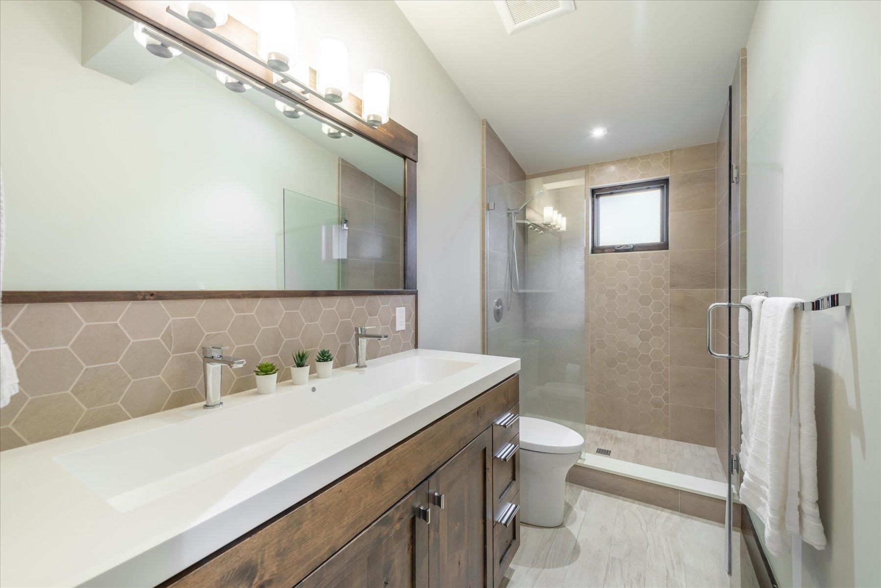 11460 Ghirard Road Truckee, CA 96161 - Photo 18 of 21 a bathroom with a sink a toilet and shower