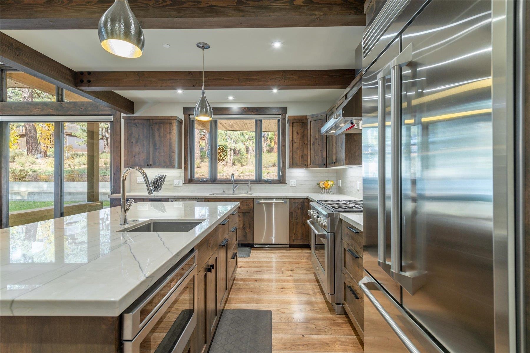 11460 Ghirard Road Truckee, CA 96161 - Photo 7 of 21 a kitchen with stainless steel appliances granite countertop a sink stove and refrigerator