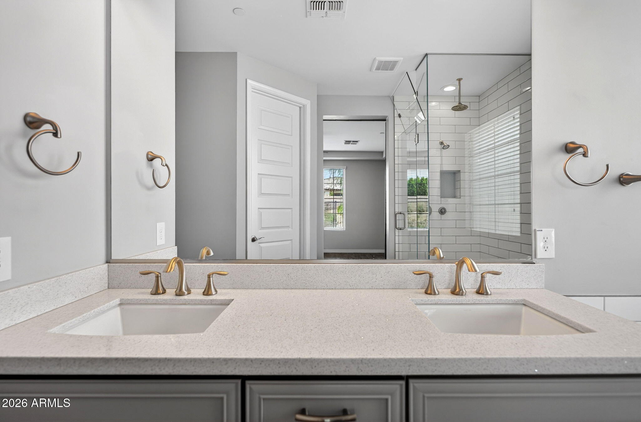 12124 West Peak View Road Peoria, AZ 85383 - Photo 20 of 38 a bathroom with a sink and a mirror