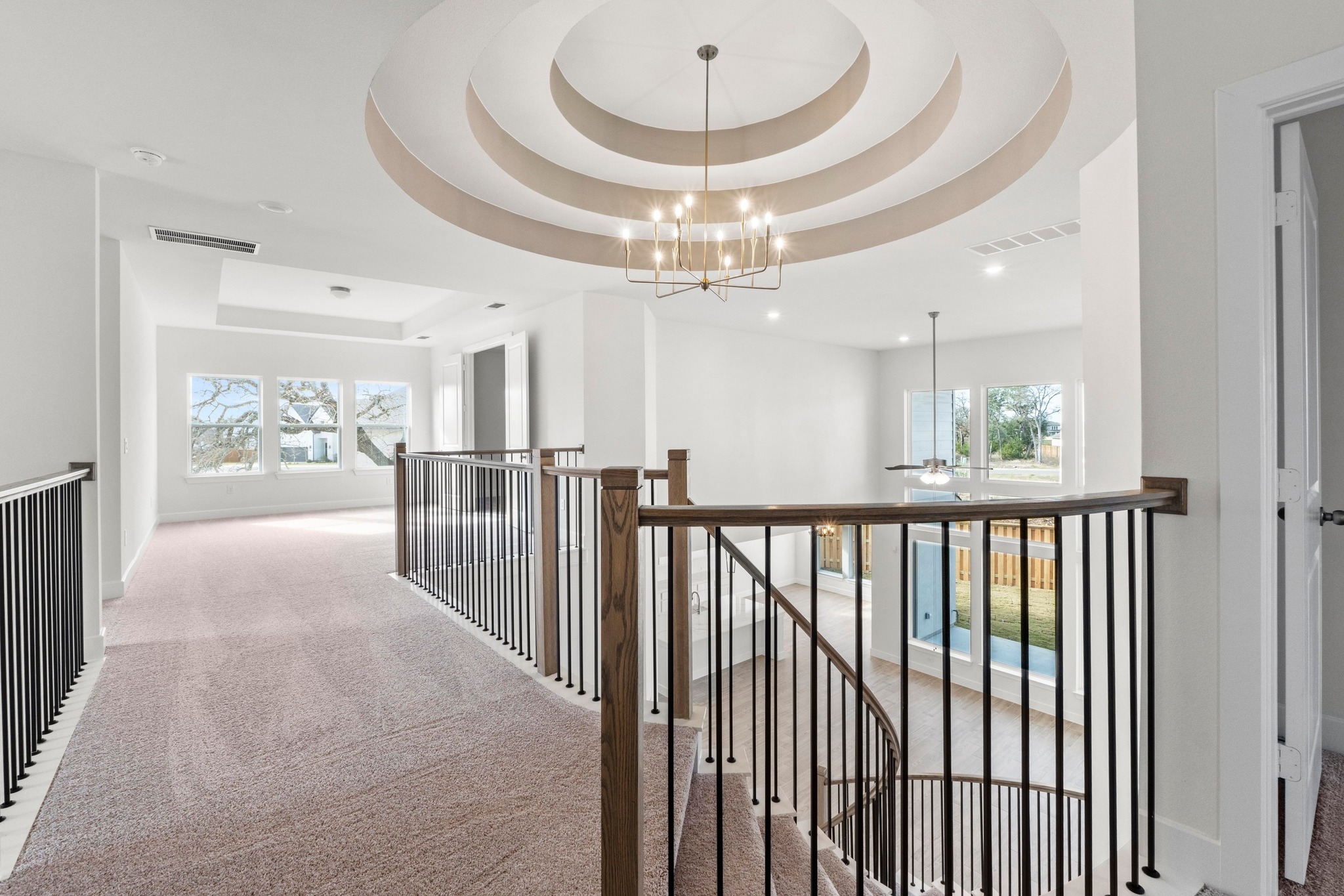 604 Lightstone Drive Georgetown, TX 78633 - Photo 30 of 39 a view of a hallway with wooden floor and staircase