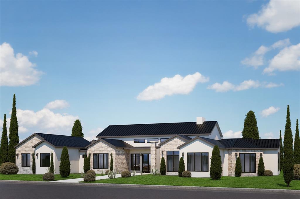 a front view of residential houses with yard and green space