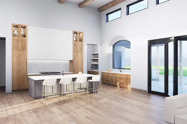 a living room with furniture and large window