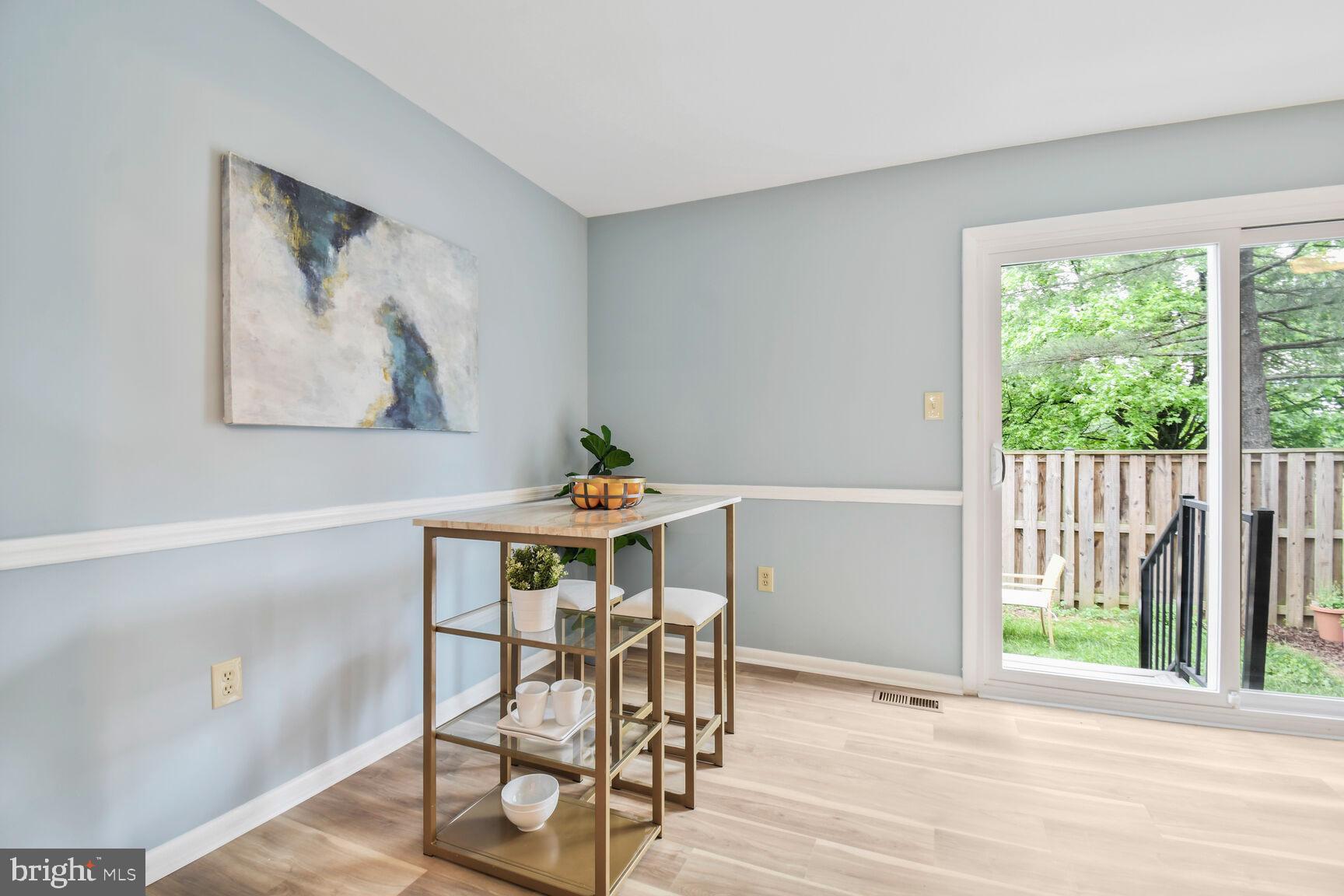 2895 Schoolhouse Circle Silver Spring, MD 20902 - Photo 11 of 33 a view of a dining room with furniture and wooden floor