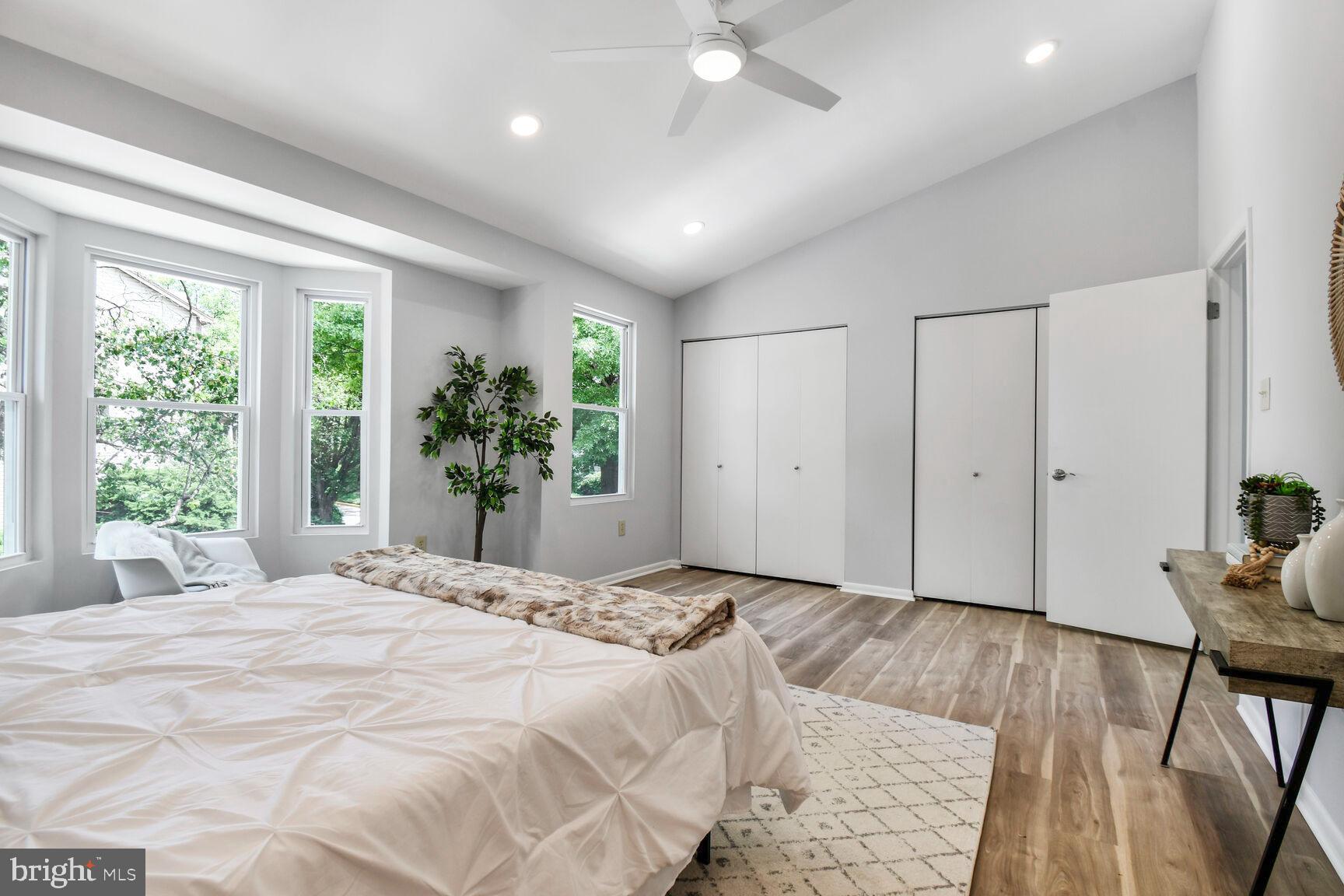 2895 Schoolhouse Circle Silver Spring, MD 20902 - Photo 18 of 33 a large bedroom with a bed and a large window