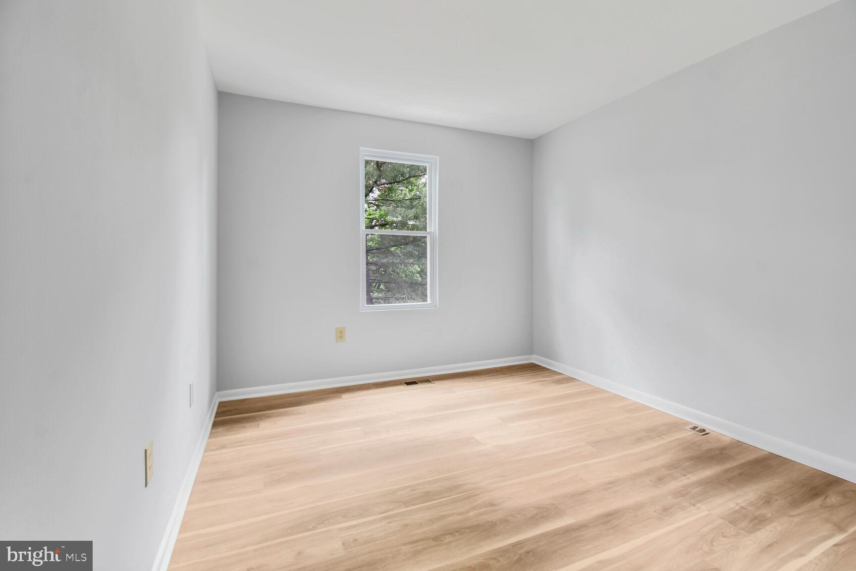 2895 Schoolhouse Circle Silver Spring, MD 20902 - Photo 19 of 33 an empty room with a window