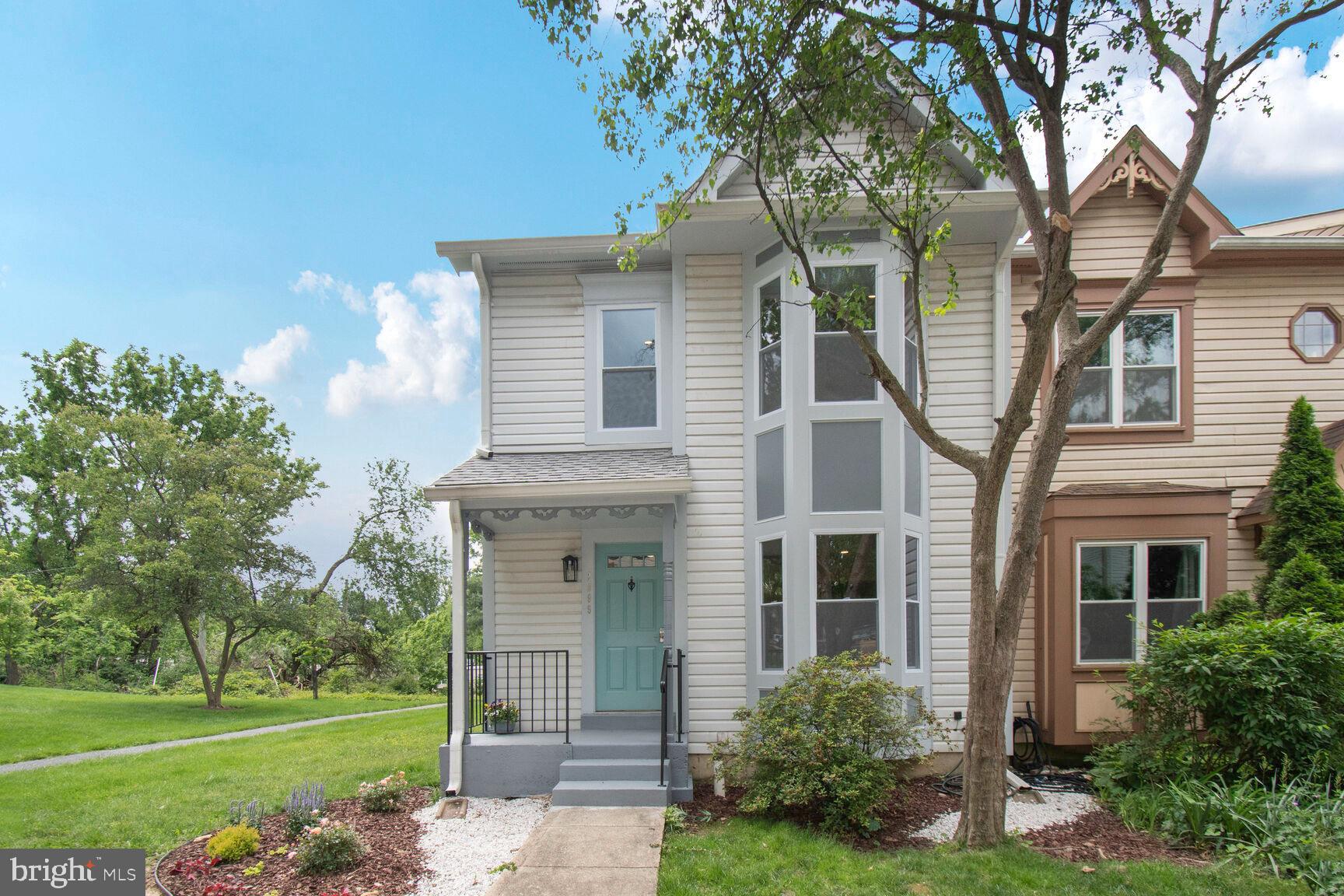 2895 Schoolhouse Circle Silver Spring, MD 20902 - Photo 2 of 33 a front view of a house with a yard