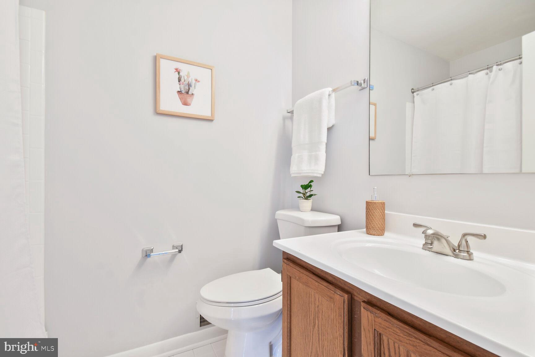 2895 Schoolhouse Circle Silver Spring, MD 20902 - Photo 21 of 33 a bathroom with a sink and a toilet