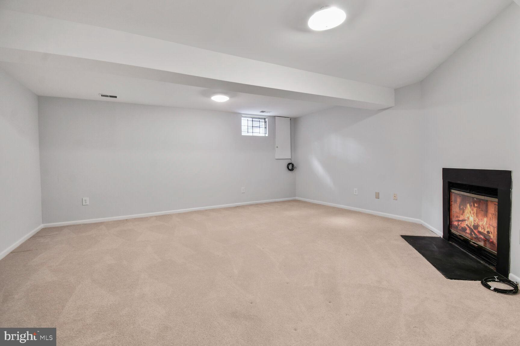 2895 Schoolhouse Circle Silver Spring, MD 20902 - Photo 24 of 33 a view of an empty room with wooden floor and a window