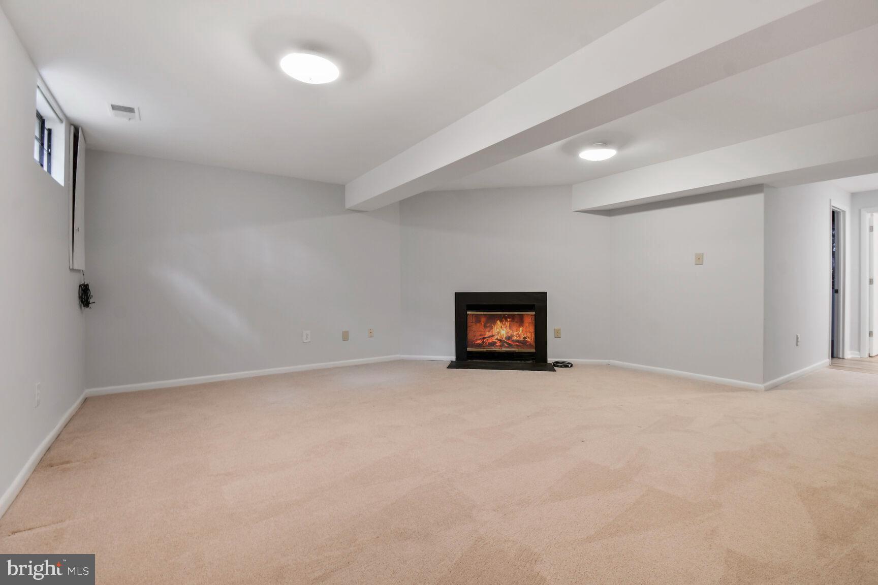 2895 Schoolhouse Circle Silver Spring, MD 20902 - Photo 25 of 33 a view of an empty room with a fireplace