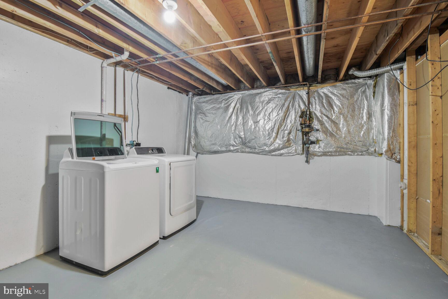 2895 Schoolhouse Circle Silver Spring, MD 20902 - Photo 28 of 33 a view of storage and utility room with washer and dryer