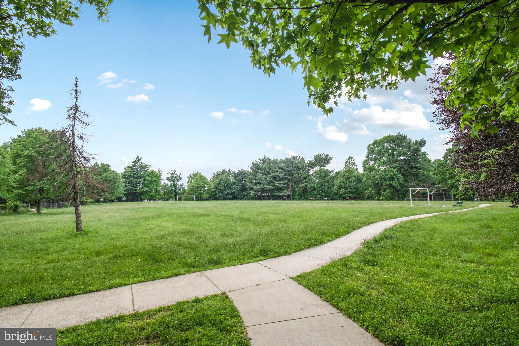 2895 Schoolhouse Circle Silver Spring, MD 20902 - Photo 31 of 33 a view of grassy field with trees
