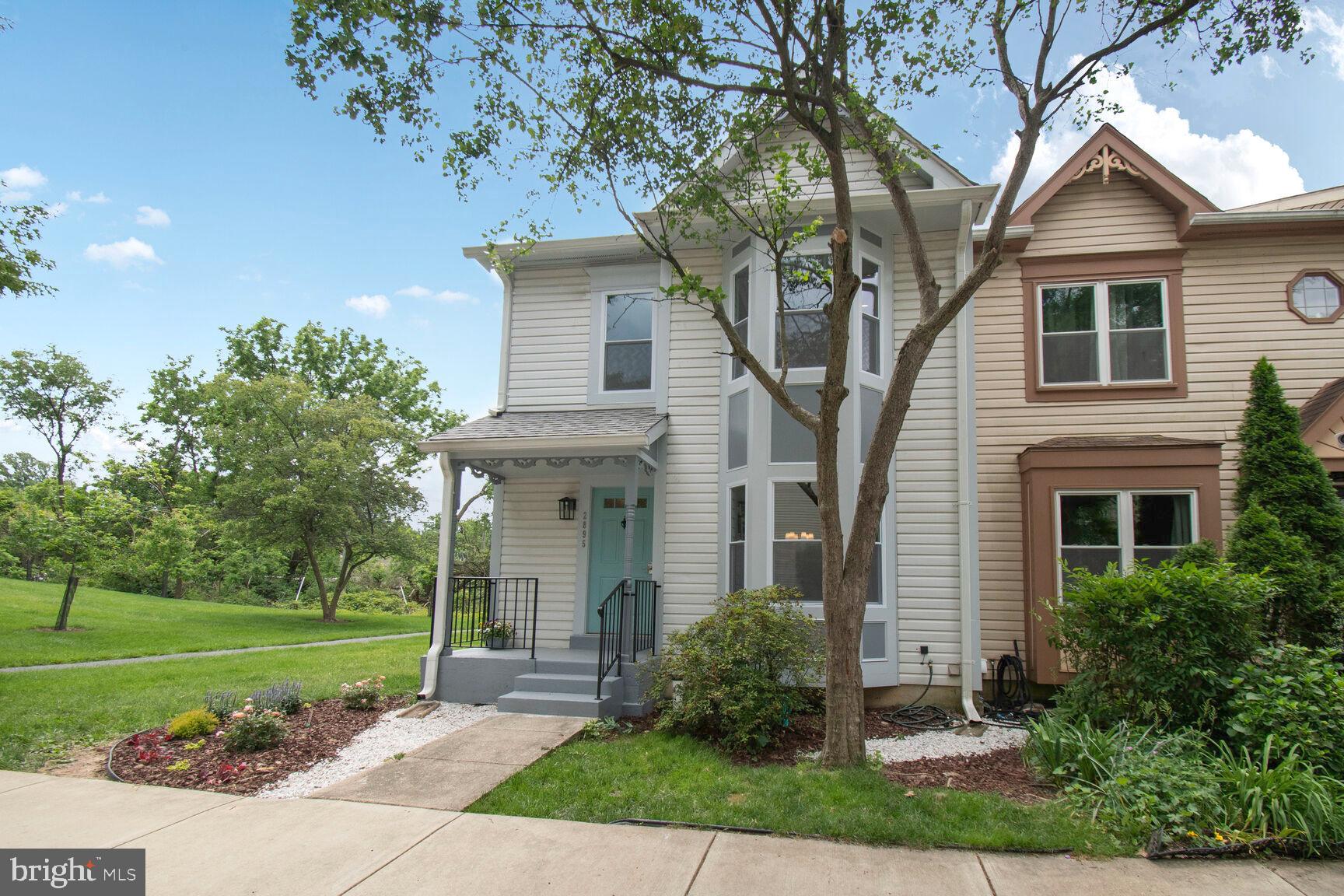 2895 Schoolhouse Circle Silver Spring, MD 20902 - Photo 33 of 33 a front view of a house with a yard