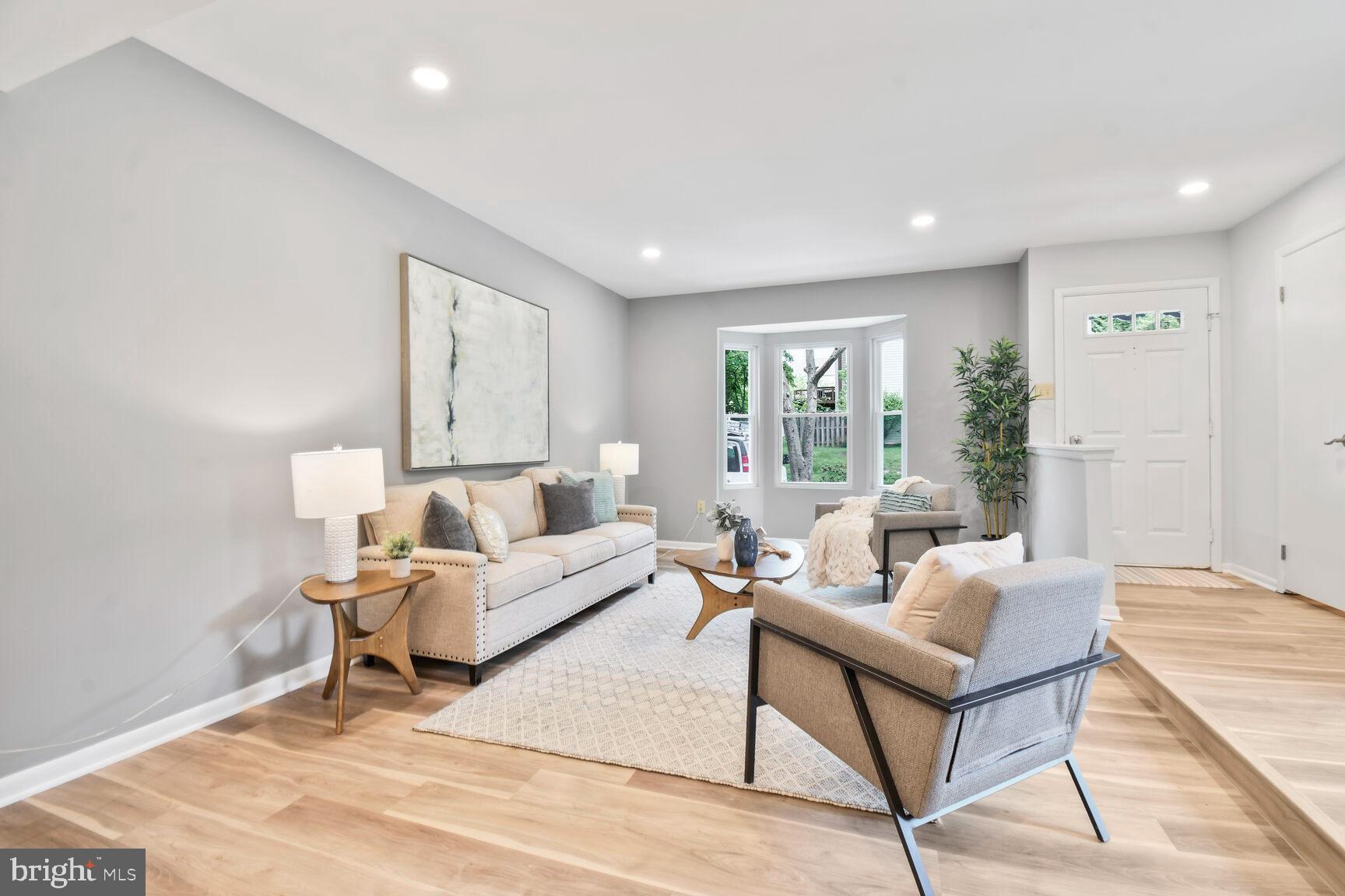 2895 Schoolhouse Circle Silver Spring, MD 20902 - Photo 6 of 33 a living room with furniture and a large window
