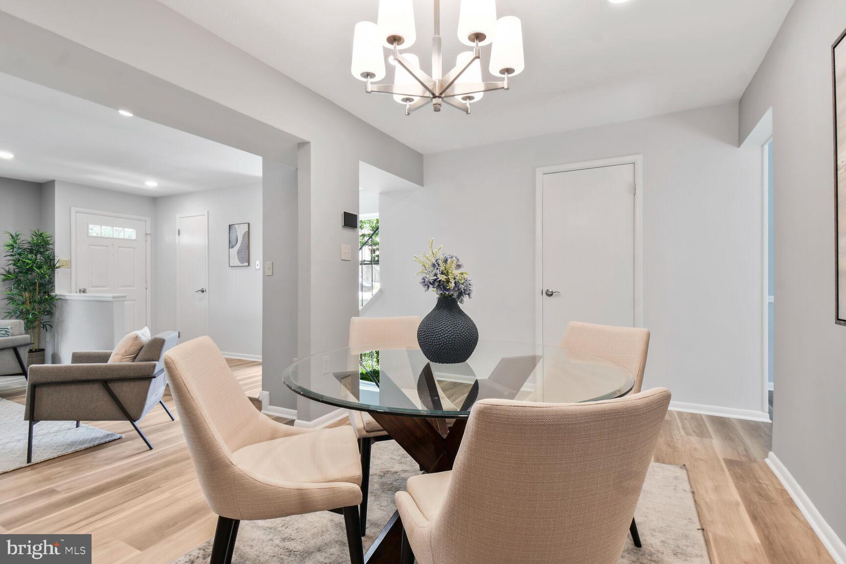 2895 Schoolhouse Circle Silver Spring, MD 20902 - Photo 9 of 33 a view of a dining room with furniture and chandelier