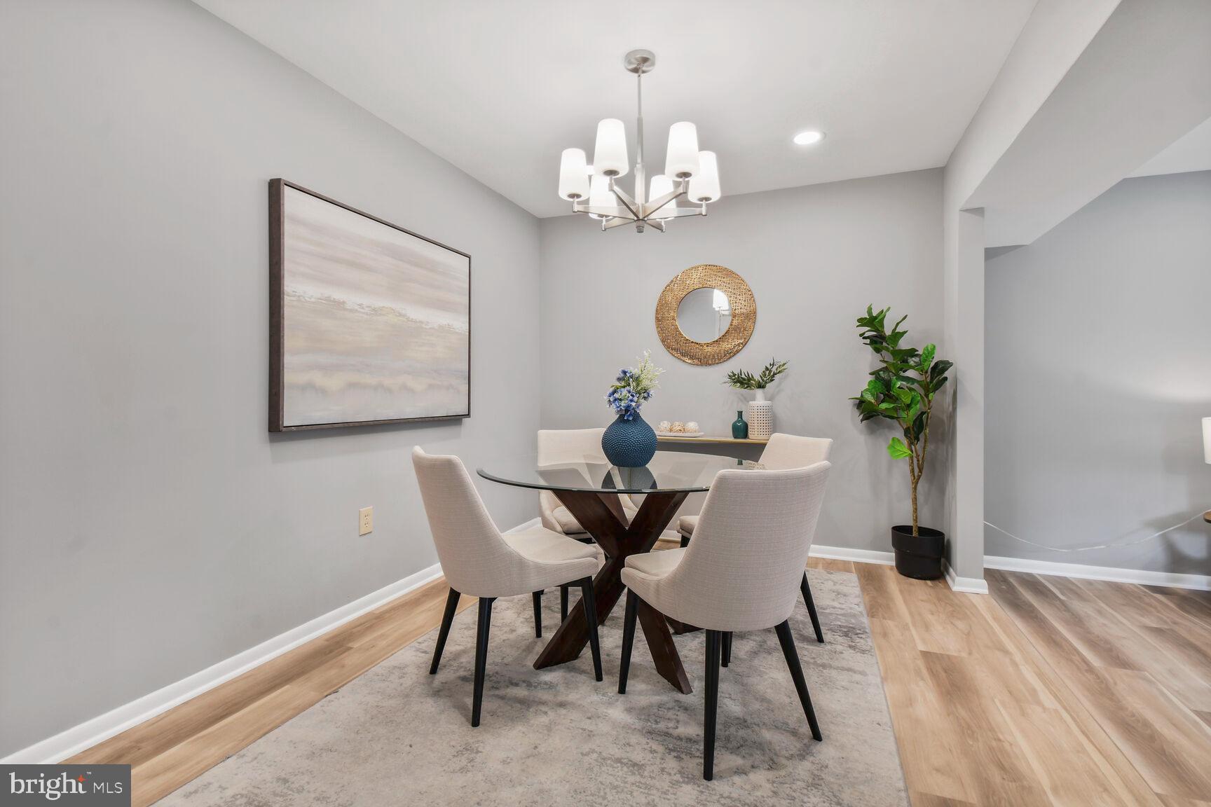 2895 Schoolhouse Circle Silver Spring, MD 20902 - Photo 10 of 33 a view of a dining room with furniture and chandelier