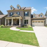 a front view of a house with swimming pool having outdoor seating