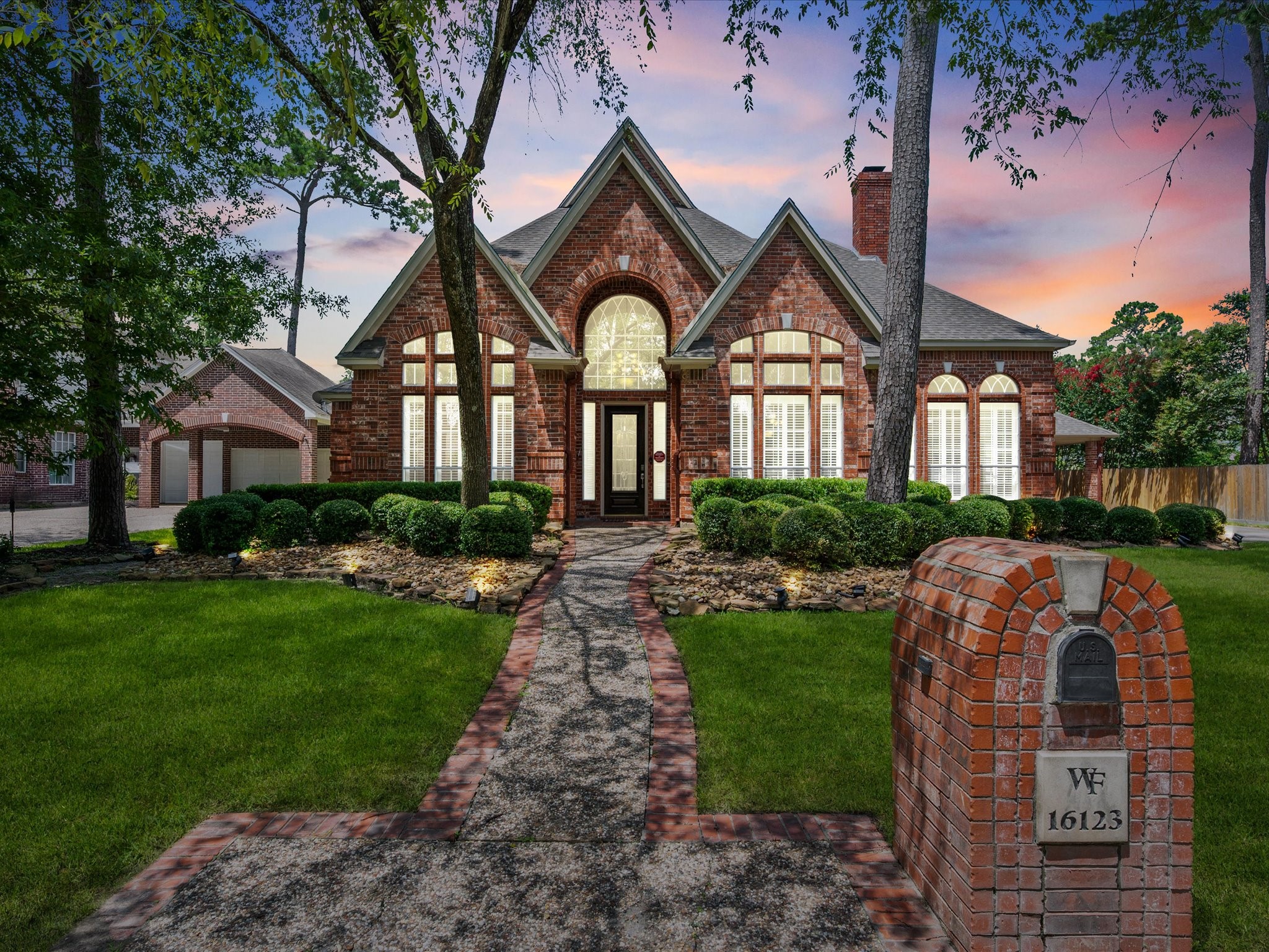 Timeless curb appeal shines through with an impressive full brick façade, lush landscaping, and a perfectly manicured lawn that creates a memorable first impression.